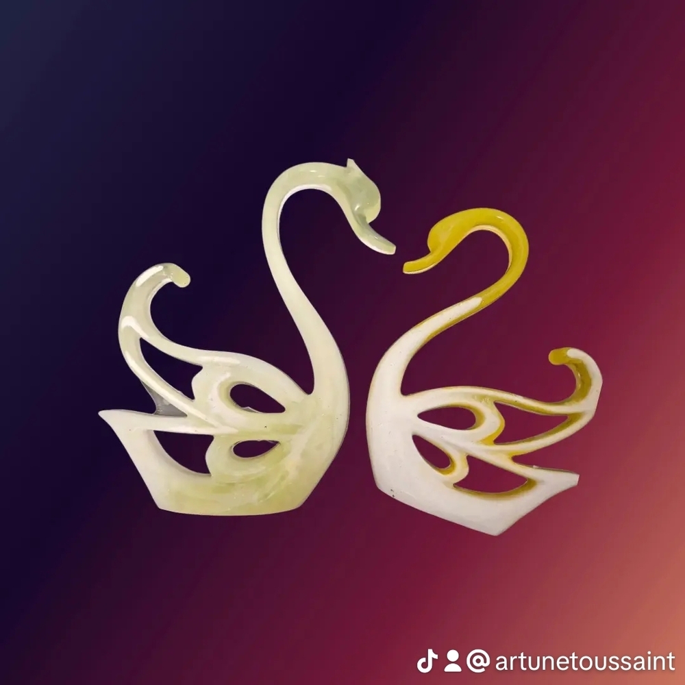 Graceful Swan Sculptures in Yellow and Cream